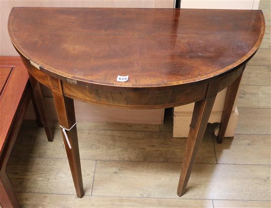 A George III mahogany demi lune table W.92cm